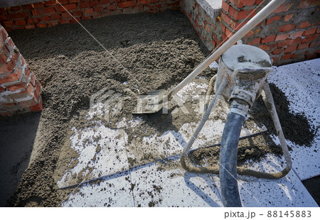 Close up of cement with shovel for construction of walls. Concept of process construction of house or shop with special materials and equipments. Close up of cement with shovel for construction of walls. Concept of process construction of house or shop with special materials and equipments. 88145883
