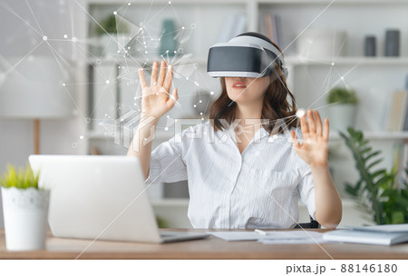 Woman with VR virtual reality goggles Woman with VR virtual reality goggles 88146180