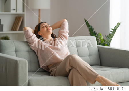 woman resting on a sofa 88146194