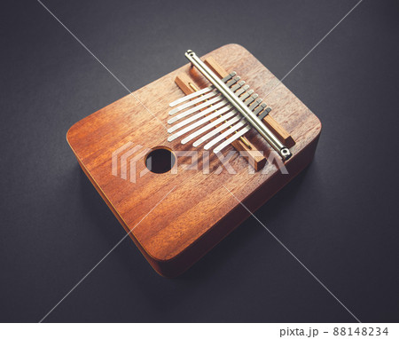 Traditional wooden kalimba isolated on black Traditional wooden kalimba isolated on black 88148234