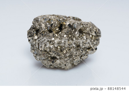 Raw crystalline pyrite iron pyrite, fool's gold . Mineral pyrite from the group of sulfides. The mineral pyrite on a white background Raw crystalline pyrite iron pyrite, fool's gold . Mineral pyrite from the group of sulfides. The mineral pyrite on a white background 88148544