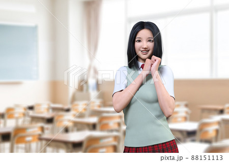 グリーンのベストを着たセミロングの女子高生が机が並ぶ教室で手を組むポーズをしている グリーンのベストを着たセミロングの女子高生が机が並ぶ教室で手を組むポーズをしている 88151113