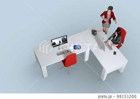 L字にした机でパソコンに向かい作業をする女性社員と進捗状況を確認  