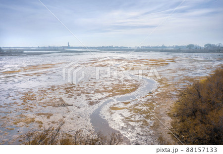 Mud flats of Venetian lagoon. Shallow coast of Torcello island, Italy at the low tide 88157133