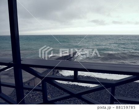 Dark natural background of inclement weather on the sea. Black sea and gray sky. Rain and waves. 88159785
