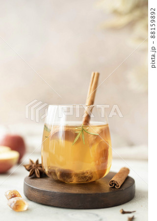 apple tea with honey and cinnamon in a glass bottle apple tea with honey and cinnamon in a glass bottle 88159892