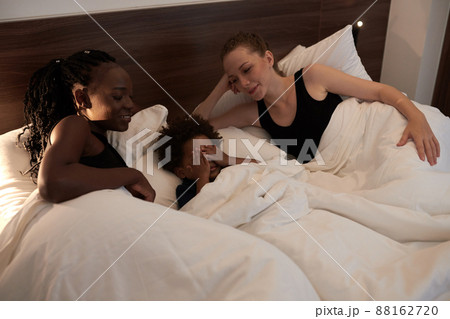 Mothers Looking at Sleeping Toddler 88162720