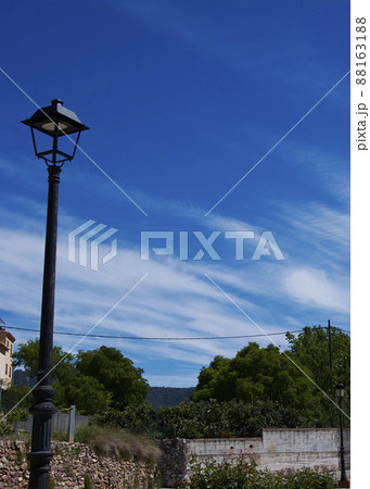 Rustic lamppost in the middle of the field 88163188
