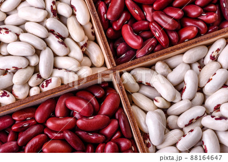 Beans of red and white dry raw beans on a dark concrete background Beans of red and white dry raw beans on a dark concrete background 88164647