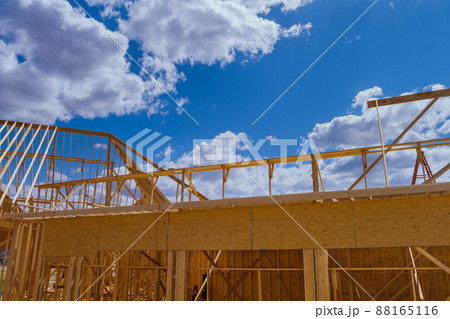 Closeup new stick built home under construction under framing structure wood frame of house Closeup new stick built home under construction under framing structure wood frame of house 88165116