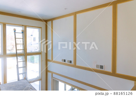 Under construction interior is installing drywall the room in new home 88165126