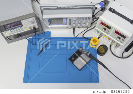 Power supplies and electronic measuring devices in the laboratory. Top view. 88165236