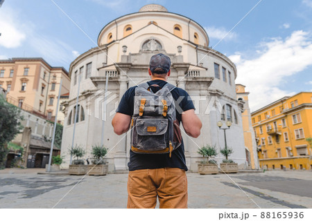 tourist man with backpack looking at saint Vitus Cathedral tourist man with backpack looking at saint Vitus Cathedral 88165936