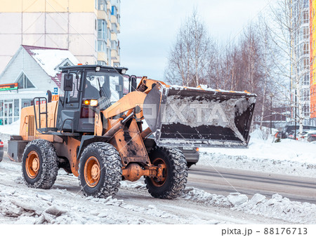 Cleaning and cleaning of roads in the city from snow in winter 88176713