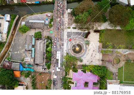 Aerial view Drone flying over phuket city Thailand.Drone over a street night market in Sunday at Phuket Town and Tourists walking shopping at old street full of local vendors selling Food and Clothes 88176958