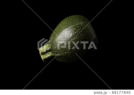 Round zucchini on a black background. Vegan and vegetarian food 88177840