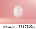 Easter white egg flying on pink background. Minimal easter concept. Happy Easter card with copy space for text. Levitating egg. 88178021