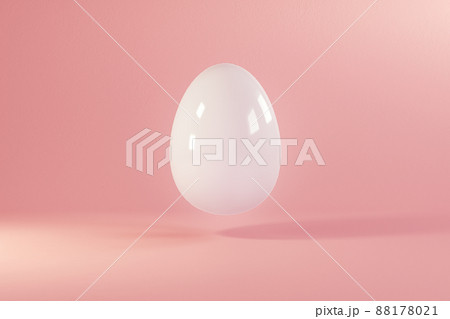 Easter white egg flying on pink background. Minimal easter concept. Happy Easter card with copy space for text. Levitating egg. 88178021