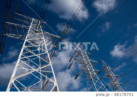 Power line tower on a background of blue sky with clouds. 88178701