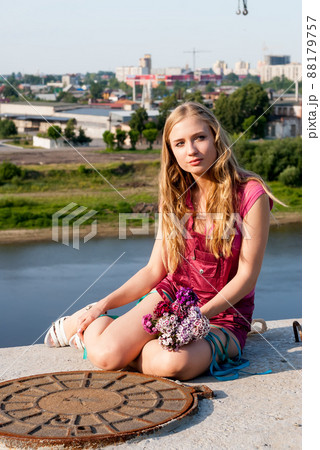 Pretty woman in pink with bouquet Pretty woman in pink with bouquet 88179757