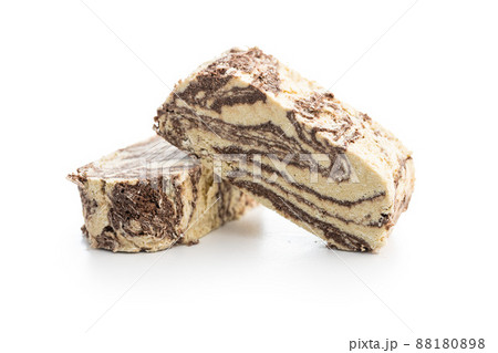Sweet tahini halva with cocoa flavor . Turkish dessert isolated on white background. 88180898