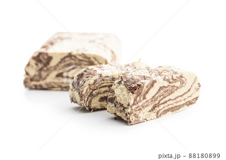 Sweet tahini halva with cocoa flavor . Turkish dessert isolated on white background. Sweet tahini halva with cocoa flavor . Turkish dessert isolated on white background. 88180899