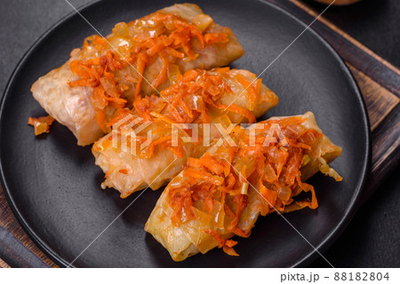 Cabbage rolls stuffed with ground beef and rice in tomato sauce 88182804