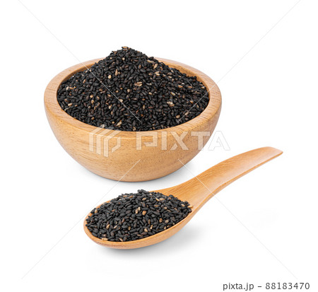 Black sesame seeds in wooden spoon and wooden bowl isolated on white background. Black sesame seeds in wooden spoon and wooden bowl isolated on white background. 88183470