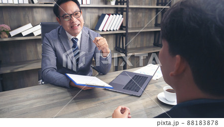 Businessman job interview by human resource HR officer interviwing, talk new employee shaking hands in office with smiling face. HR Manager interview check resume, face to face. Job Interview Concept 88183878