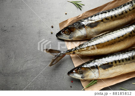 Tasty smoked mackerel fish on grey table 88185812