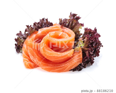 Salmon slices with salad isolated on white. 88186210
