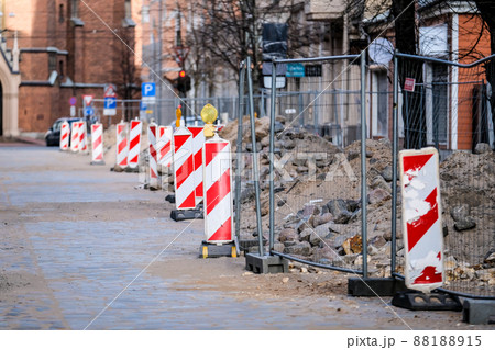 Road works in the city, oldtown. Stack with cobblestone, paving. Selective focus 88188915