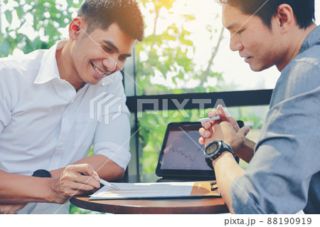 Two businessmen are consulting and planning business operations. Two businessmen are consulting and planning business operations. 88190919