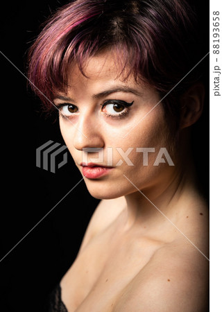 Fashion portrait of a 23 year old white woman with short, dyed hair Fashion portrait of a 23 year old white woman with short, dyed hair 88193658