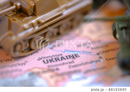 Calgary, Alberta, Canada. Mar 28, 2022. Macro Top view of Scale Model Tanks War Panther Tanks on a Ukraine map. Concept 88193695