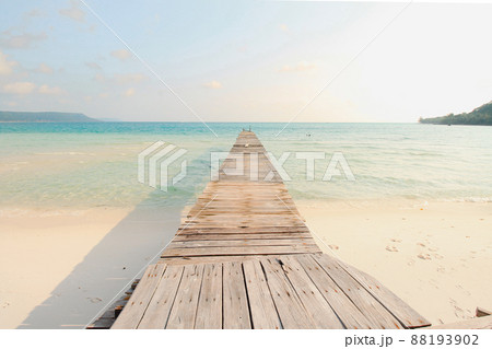 Scenic view of a wooden boardwalk leaving to the white sandy beach of Koh Rong Samloen Island, a popular summer getaway destination in Cambodia Scenic view of a wooden boardwalk leaving to the white sandy beach of Koh Rong Samloen Island, a popular summer getaway destination in Cambodia 88193902