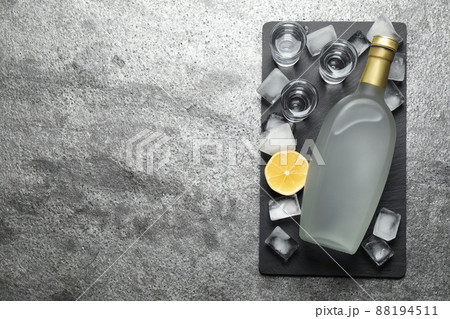 Cold Russian vodka on grey table, top view. Space for text Cold Russian vodka on grey table, top view. Space for text 88194511