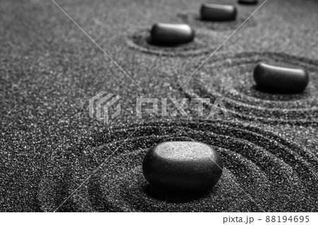 Black sand with stones and beautiful pattern. Zen concept Black sand with stones and beautiful pattern. Zen concept 88194695
