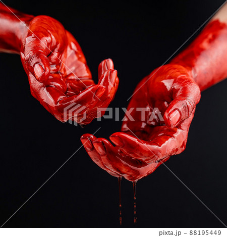 Women's hands in blood on a black background. 88195449