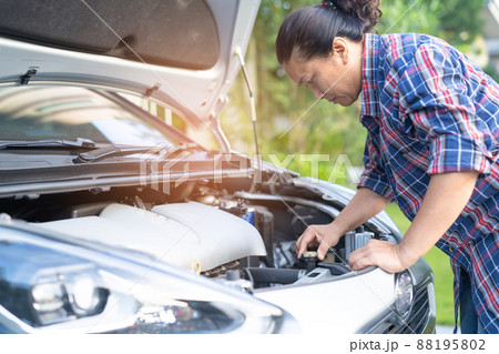 Open hood mechanic engine system to check and repair damage car crash. 88195802