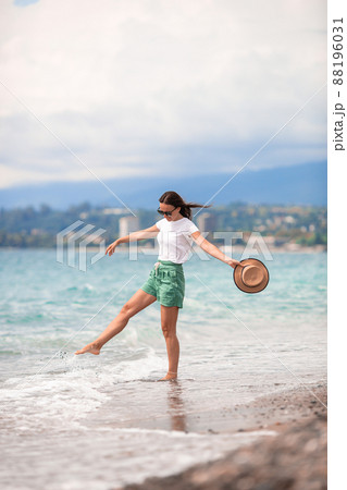 Young beautiful woman relax on the beach Young beautiful woman relax on the beach 88196031
