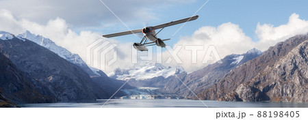 Seaplane Aircraft Flying over the Pacific Ocean Coast. 88198405