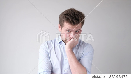 Bewildered displeased sorrorful man going to cry as sees no way out in difficult life situation. 88198475