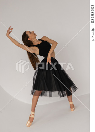 Beautiful ballerina dancing at studio in black dress, have training. Beautiful ballerina dancing at studio in black dress, have training. 88198633