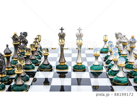 Malachite stone chess pieces on and marble chessboard Malachite stone chess pieces on and marble chessboard 88199172