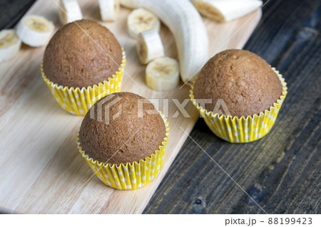delicious wheat cupcakes on a black wooden table delicious wheat cupcakes on a black wooden table 88199423