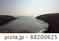 aerial drone flight over Stradbally Cove, Atlantic Ocean beach on the Cooper Coast, Waterford, Ireland. 88200625