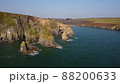 drone over the Atlantic Ocean. flying over cliffs and a blue sea. Stradbally Cove, Cooper Coast, Waterford, Ireland. 88200633