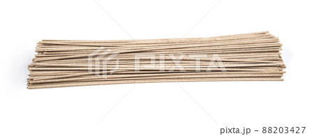 Dried raw japanese soba noodle isolated on a white background. Dried raw japanese soba noodle isolated on a white background. 88203427