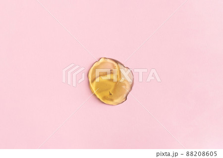 Liquid gel cosmetic product with bubbles on pink background Liquid gel cosmetic product with bubbles on pink background 88208605